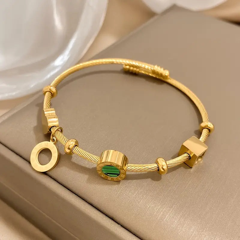 Emerald Charm Bangle – Time & Renewal
